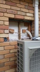 Wall ruined by an old air conditioner being removed